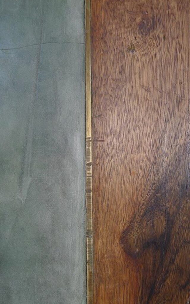 The brass inlay transition between the floorings___